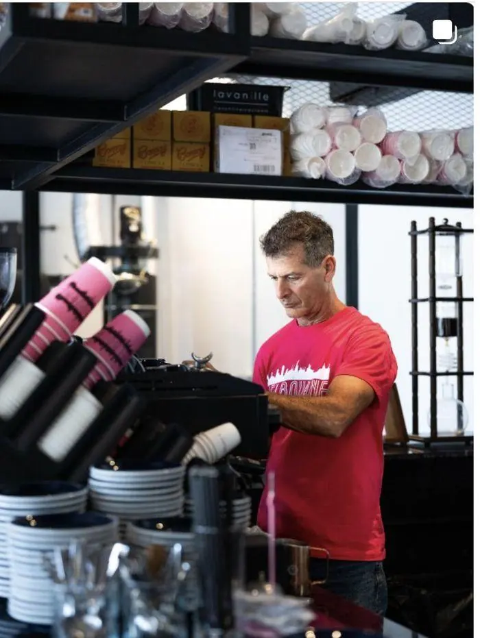 Barista working the coffee bar at Melbourne café, Makes Coffee Phuket