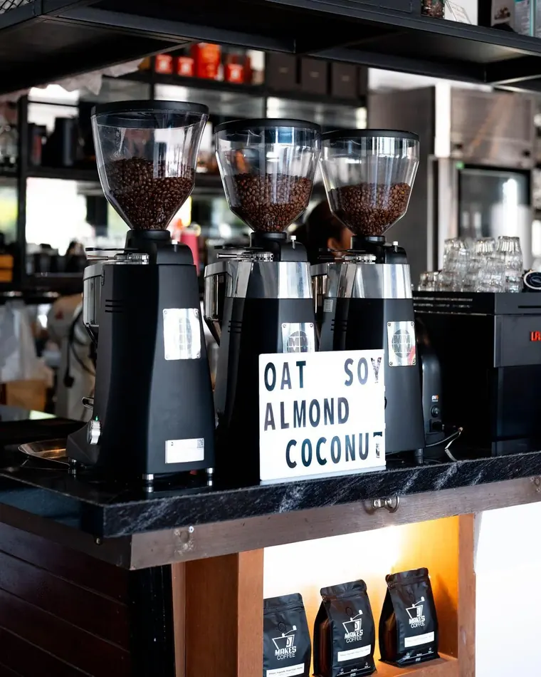 Melbourne café coffee bar with espresso grinders and Makes Coffee retail bags, Phuket